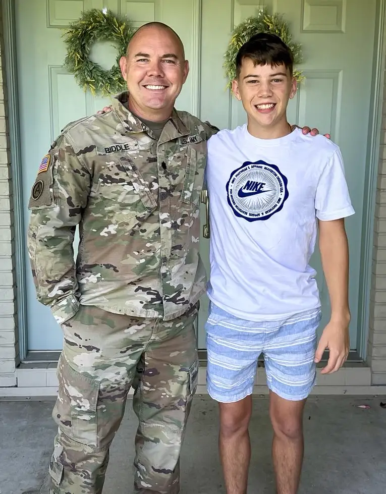 Skip Riddle is a veteran, posing with his son Landon