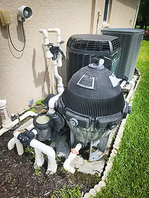 Checking for leaks around this customer's pool pump.